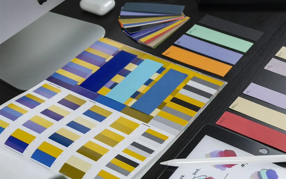 Design studio desk with colour swatches and a graphics tablet