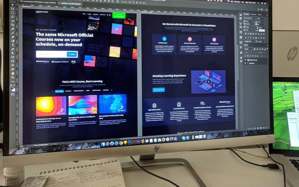 Landing page wireframe on a tablet beside a keyboard